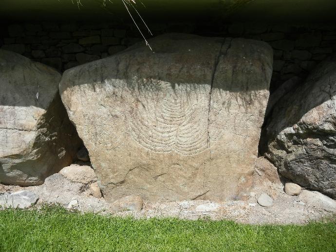 a rock with a face carved into it